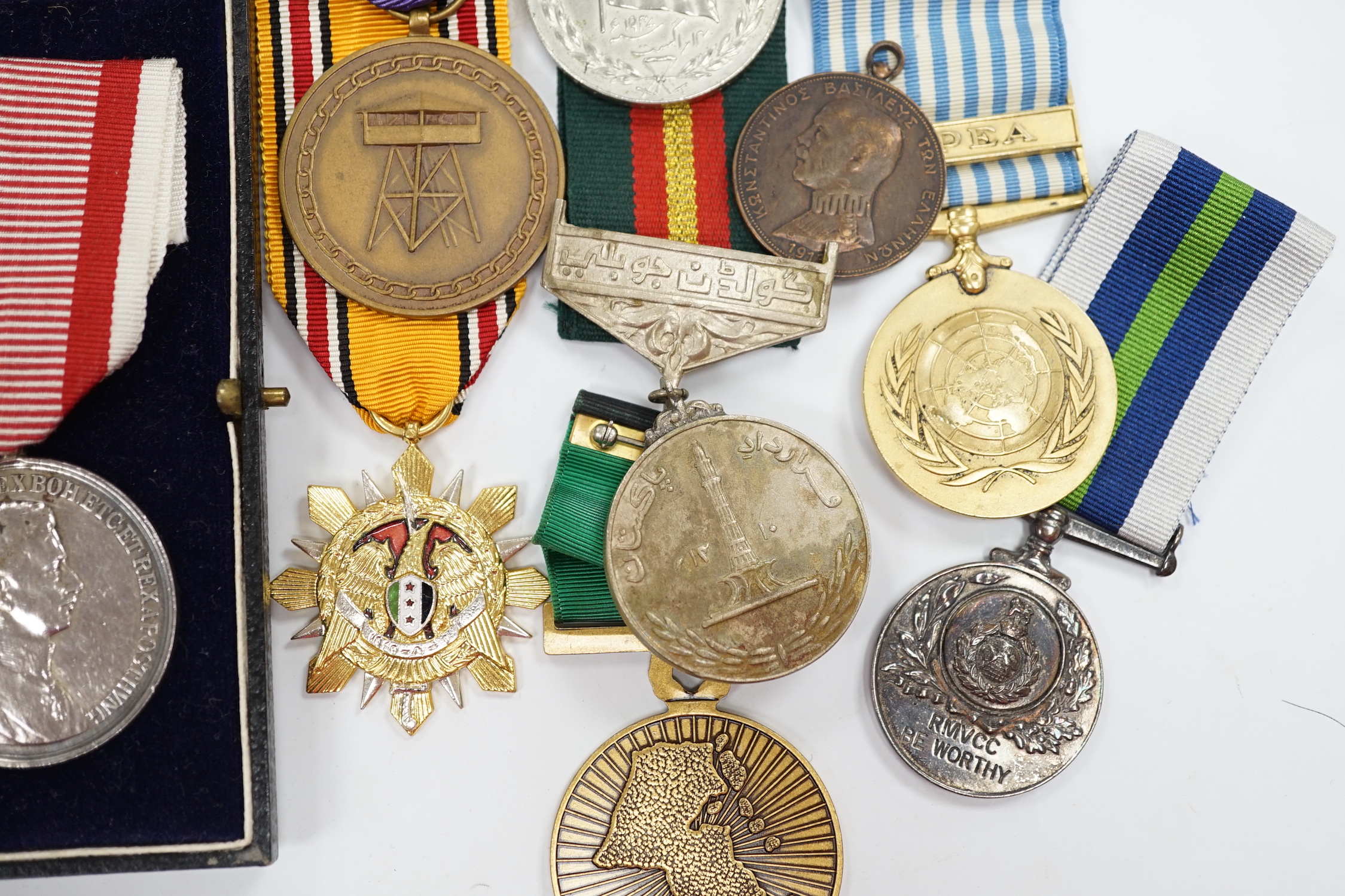 Thirty world military and commemorative medals including; a Belgium War Aid Medal 1914-18, Nigeria Republic Medal, Austri-Hungarian Medal for Bravery, Kuwaiti Liberation Medal, Pakistan Resolution Day Medal, etc.